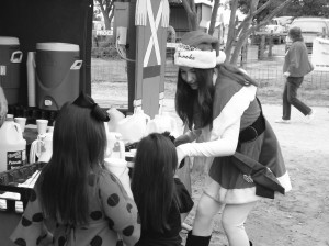 Junior Miss Congeniality Brooke Sumners brings smiles to little girls’ faces as she serves them a cup of hot chocolate at their breakfast with Santa.