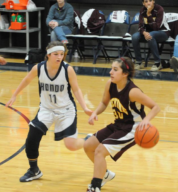 Dribbling around the defender, junior Estefant Robledo looks to make a break to the basket.