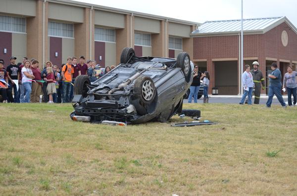 Students watch the fatal crash in horror outside of the Student Activity Center.