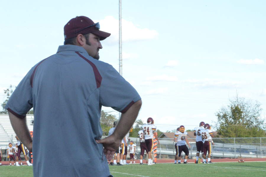 New athletic trainer Ruben Doc Alsten stands by at a junior varsity football game.