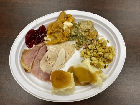 DHS teacher Mr. Tomlin and his wife bring a Thanksgiving feast to school every year for his students. 