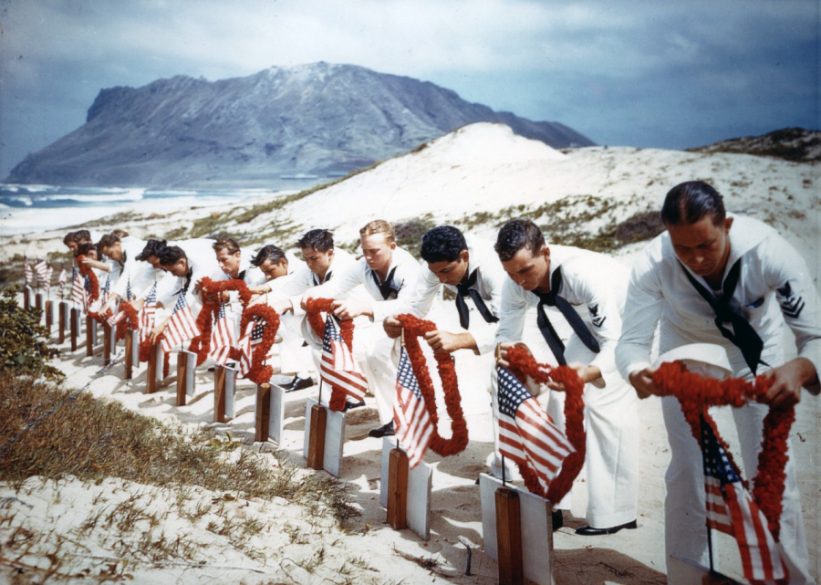 American US Navy sailors lay wreaths at Pearl Harbor.