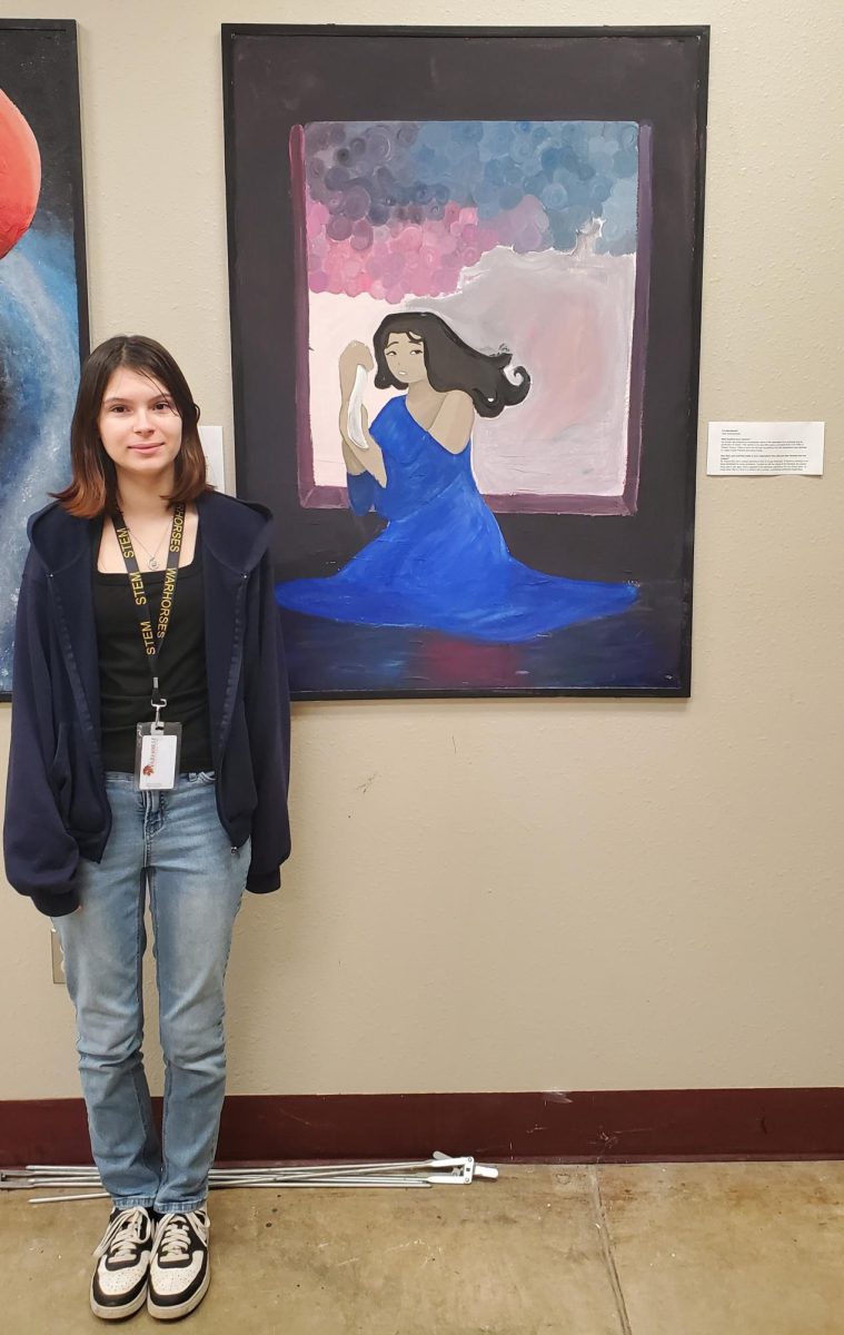 Viola Dzierzanowski stands beside her mural, "The Blindfolded".