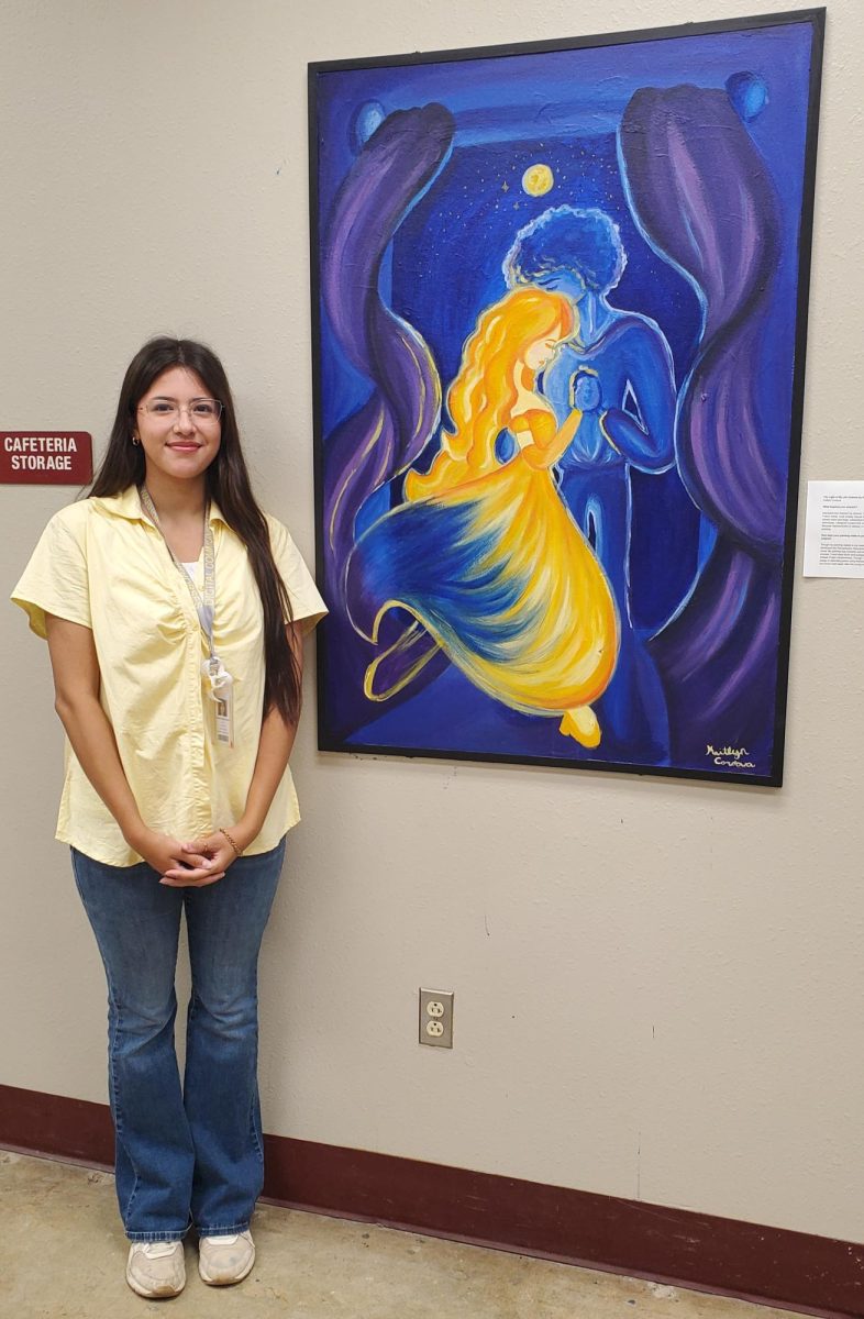 Kaitlyn Cordova stands next to her mural, "The Light of My Life Claimed by Death".