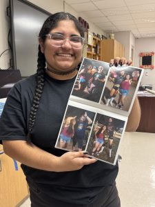 Senior Angel Marie Mason shares a look into her wrestling scrapbook, a collection of photos and memorabilia she has kept since her toddler years. The scrapbook highlights her early connection to the sport, including photos with wrestlers who have since advanced to World Wrestling Entertainment.