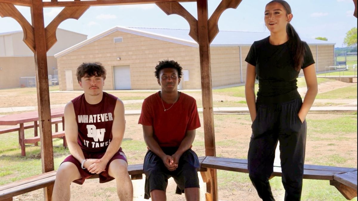 Newcomer Nayelli Munoz interviews varsity basketball players Cecilio Delagarza and Ray'Sean Beaver 