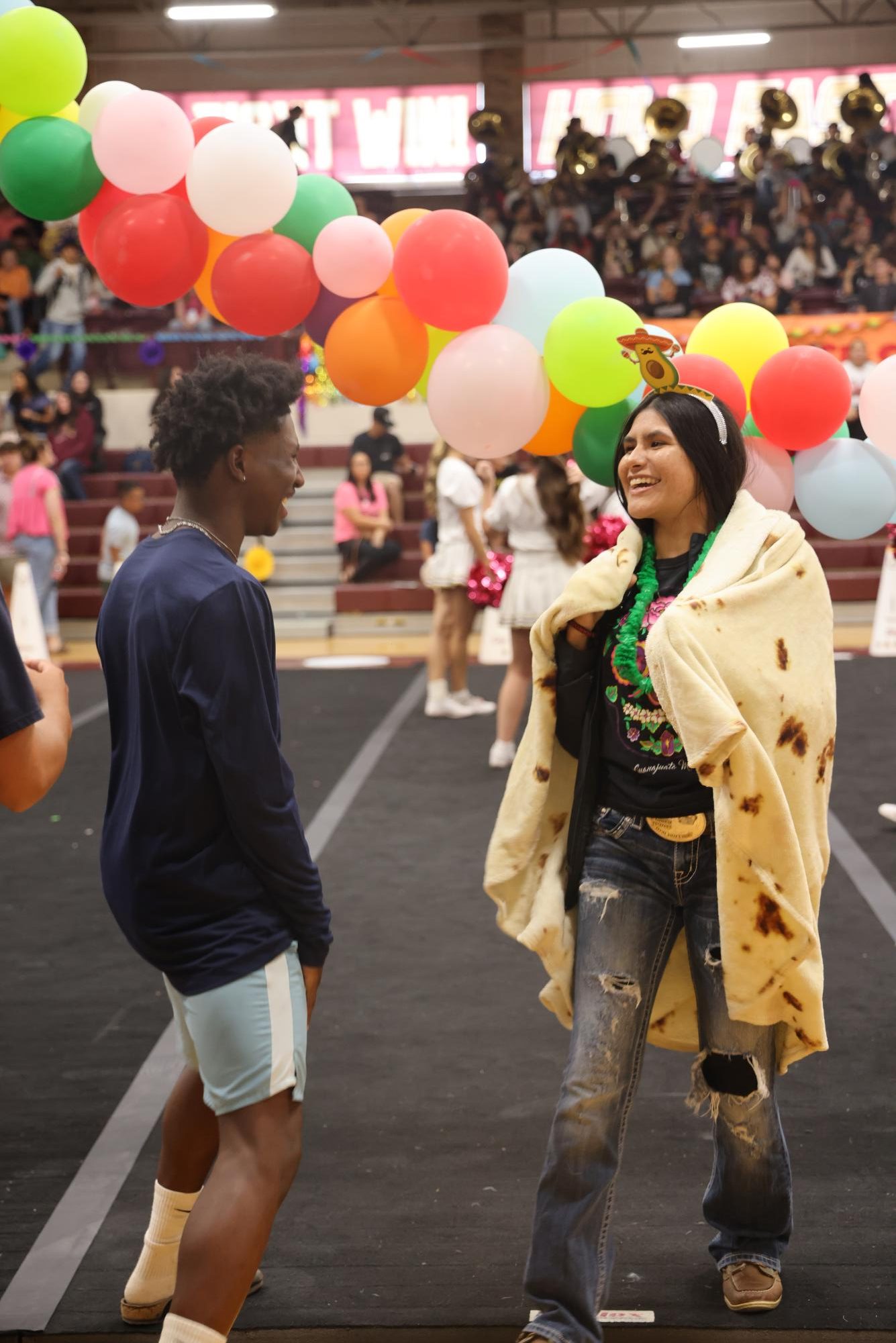 Marisol Custodio Robledo and Ray'Sean Beaver joke as they prepare for their roles in the Fiesta themed pep rally that doubles as a kick off to Hispanic Heritage Month.