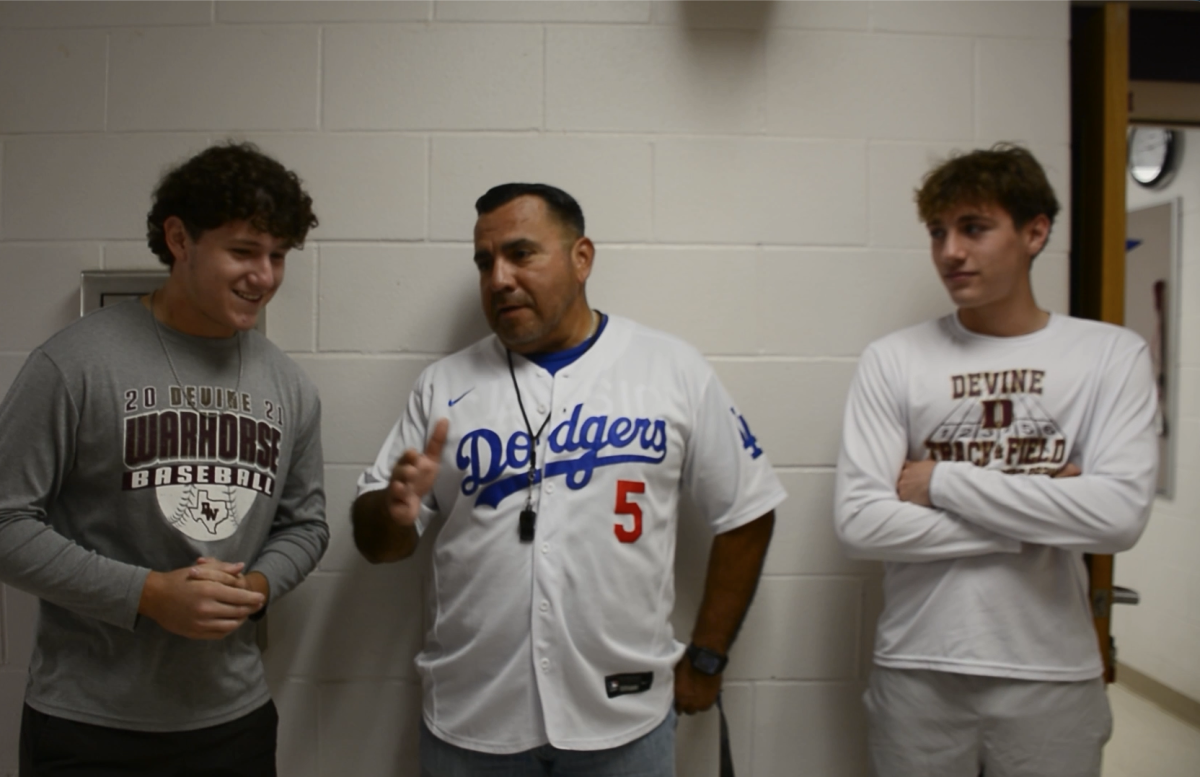 Football coach and diehard Dodgers fan Daniel Sanchez chats game three with the Warhorse Football podcasters Tuesday morning after staying awake until the end of the nearly seven hour 18 inning game that equaled the length of a double header. The game did not end until after 2 am Central Time.