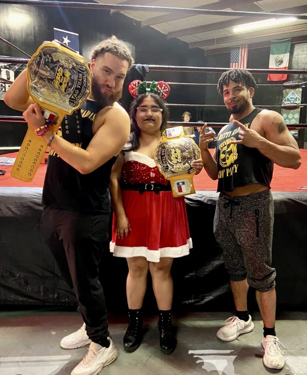 Angel Marie Mason enjoys a moment with local wresting stars.